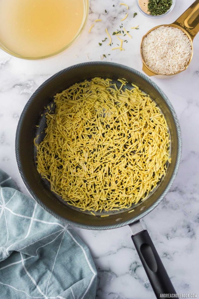 vermicelli pasta in bottom of black saucepan