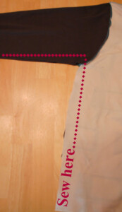 Line marking where to sew along sleeve and body seam.