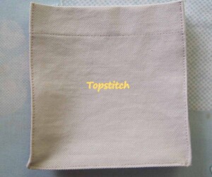 Pocket with topstitched edges for definition.