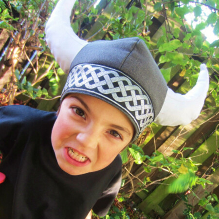 Fierce boy wearing DIY viking helmet made from costume sewing tutorial.