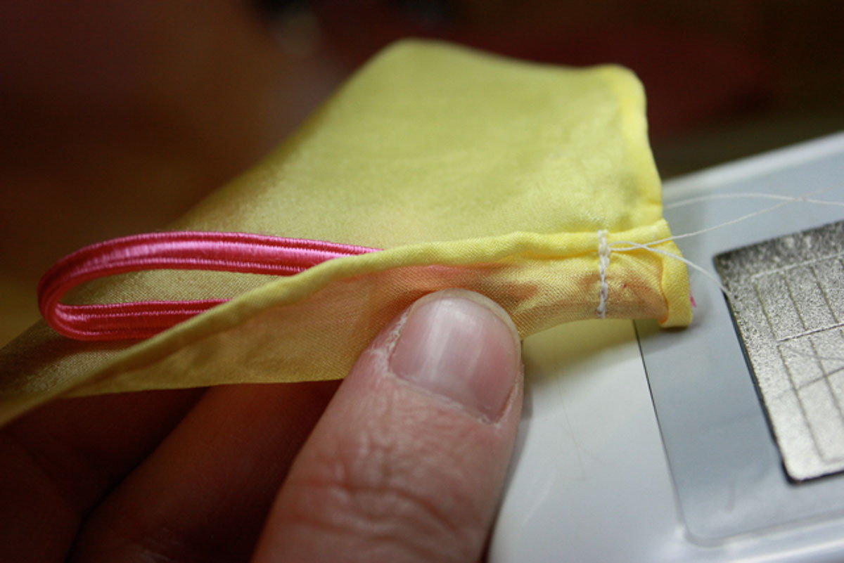 Wrist loop sewn onto wing fabric.