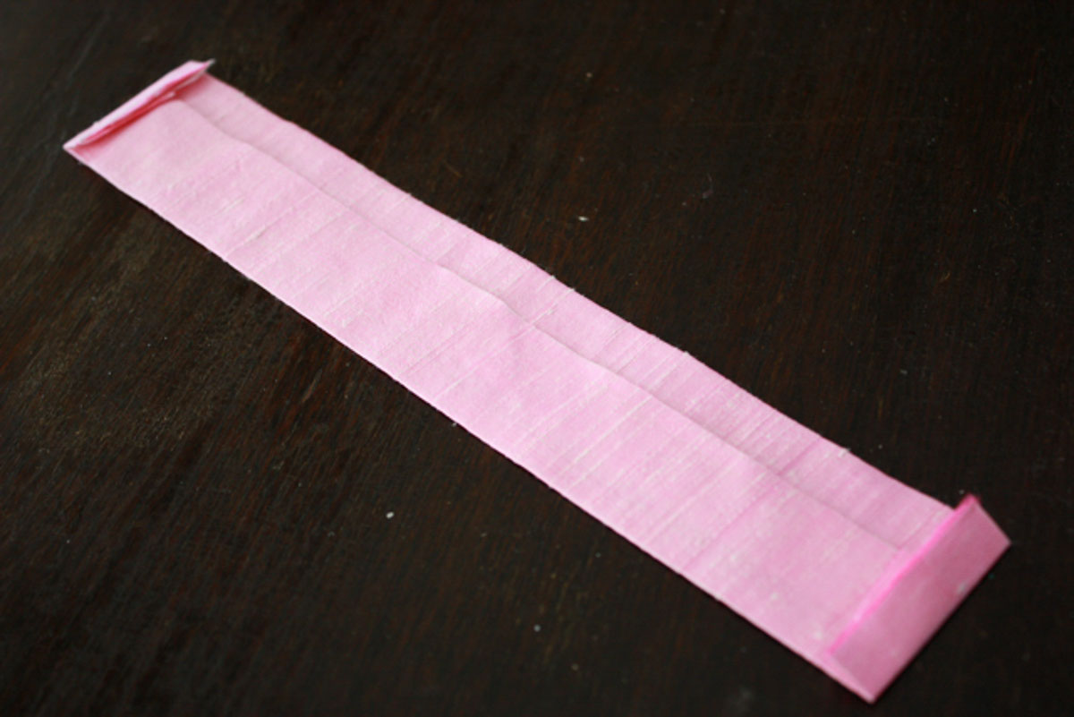 Strip of pink silk for butterfly wings.