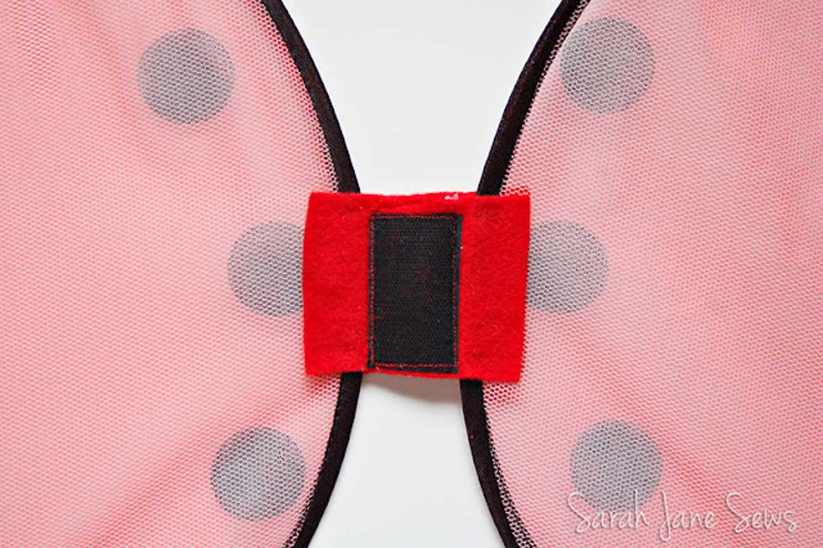 Back side of the ladybug wings with a velcro on center.