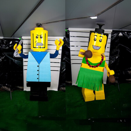DIY lego costumes: blue boy costume and green girl in hula costume.