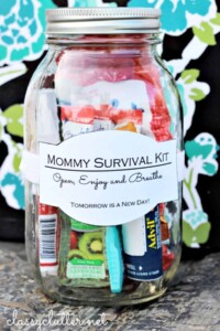 Mason jar with things inside and a label that says "mommy survival kit".