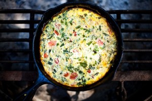 Breakfast frittata with tomatoes, basil, and cheddar cheese