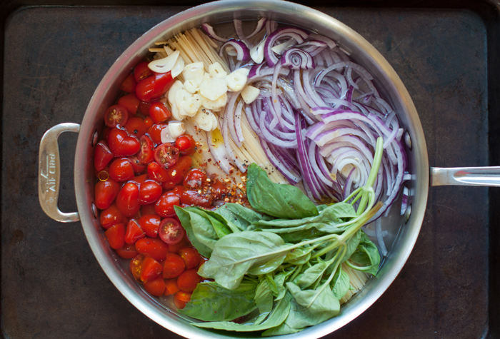 one pan pasta with linguini, red onion, and fresh tomato 