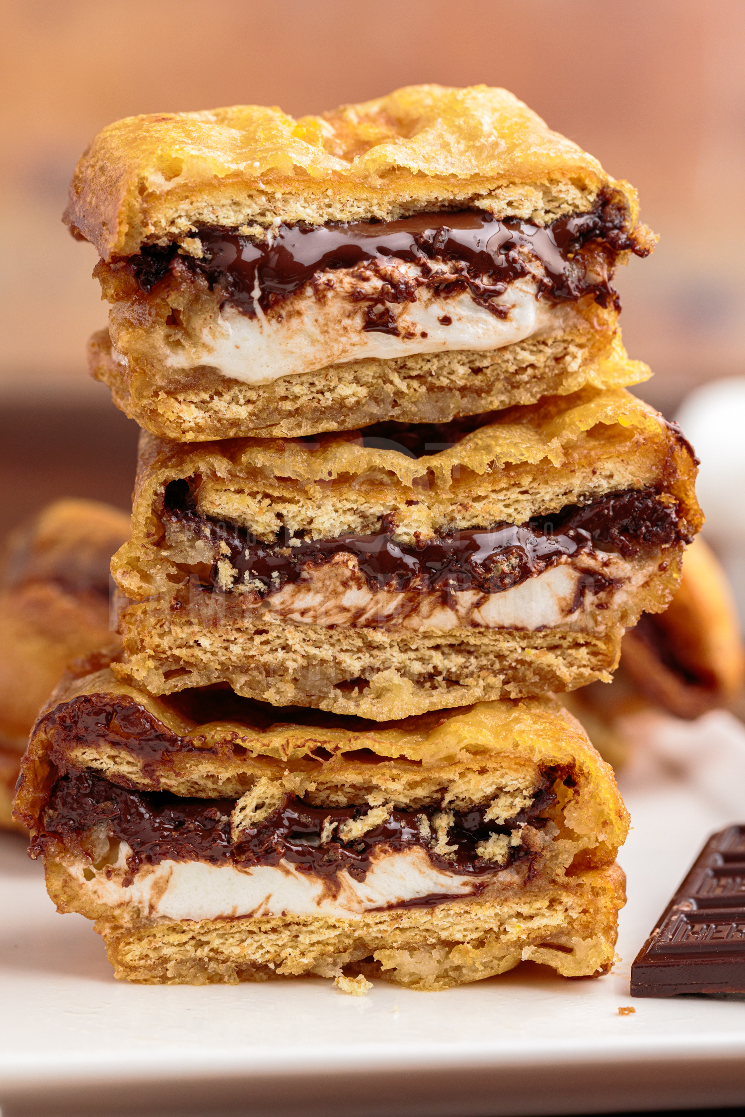 deep fried s'mores stacked on top of each other.