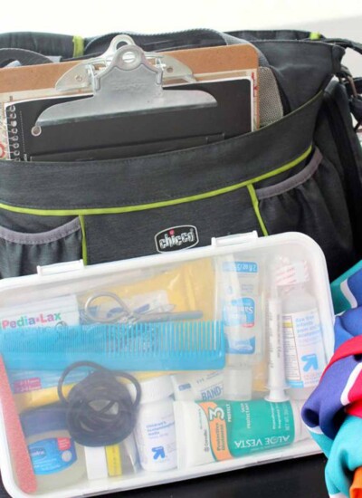 Car Survival kit in a black bag including kid essentials, first aid essentials and car essentials.