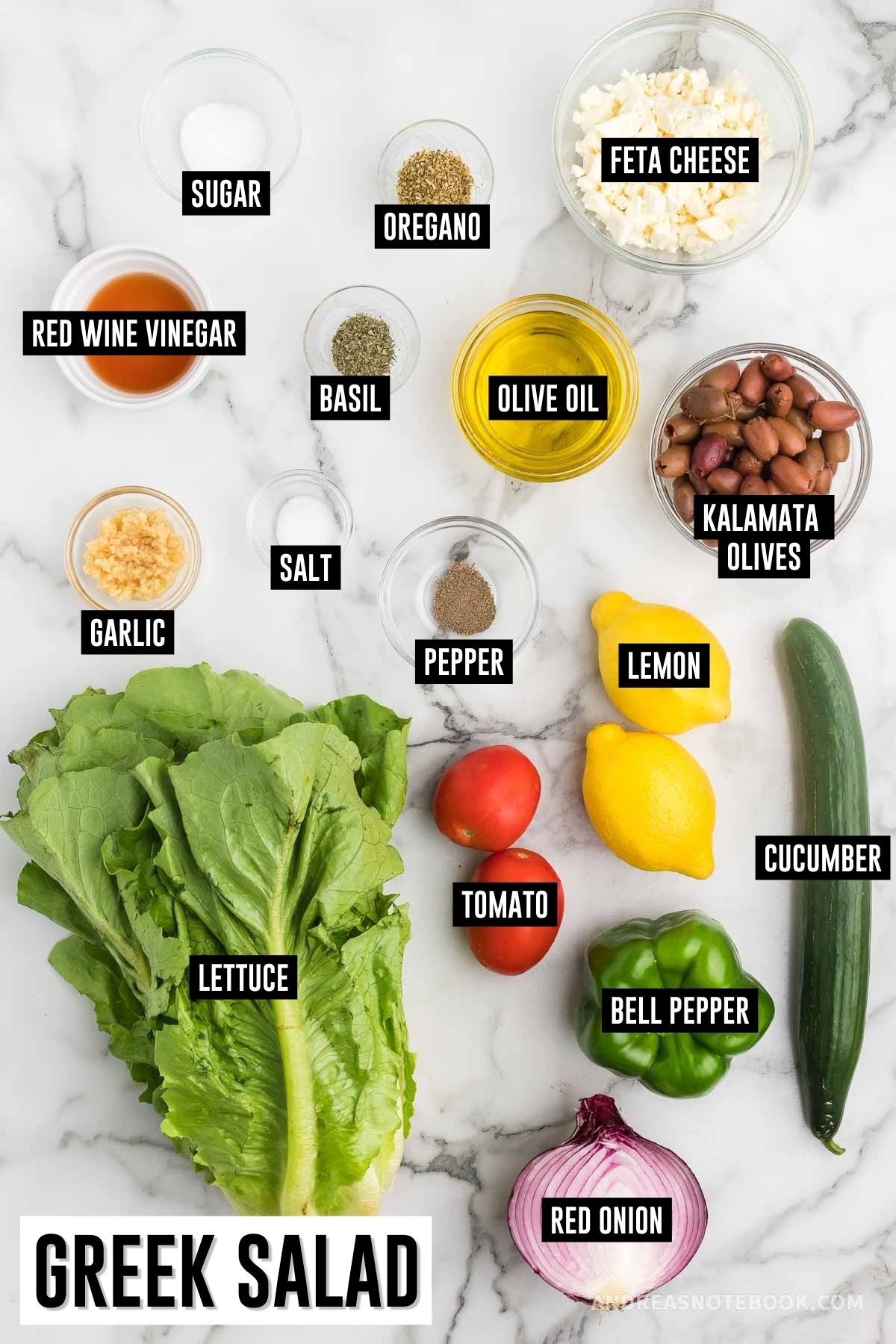 Greek salad ingredients on counter, labeled.