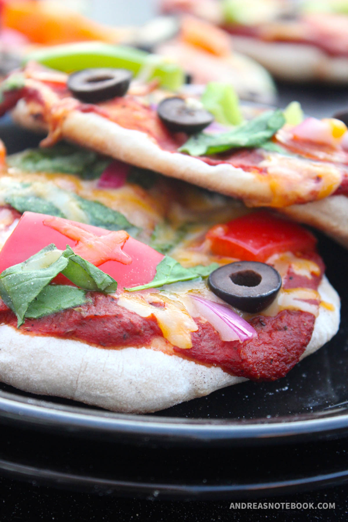 Pizzas with veggie toppings.