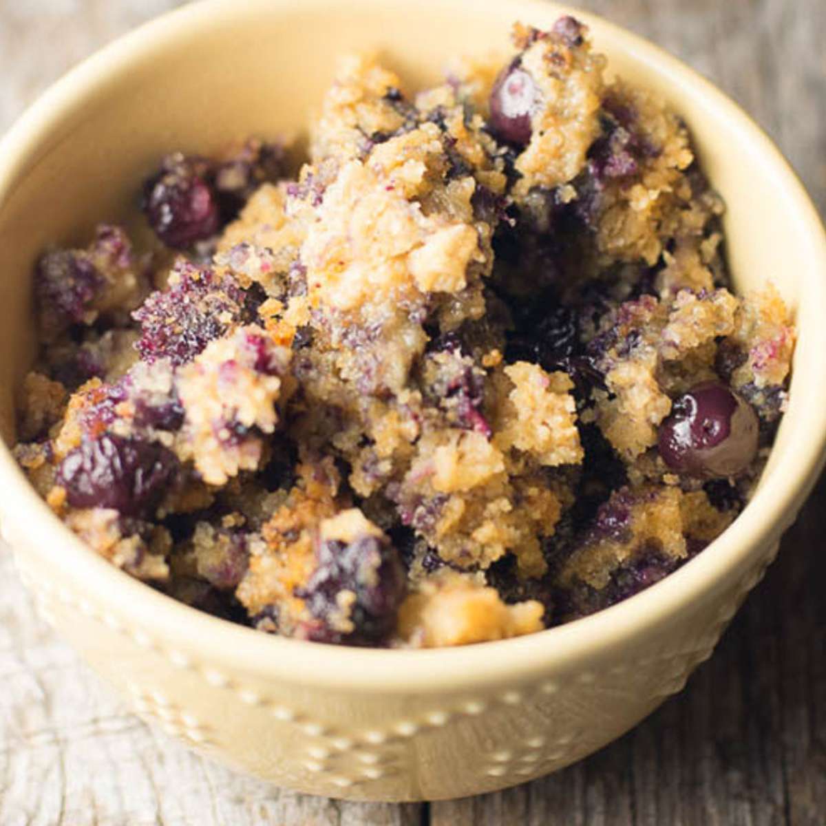 Bowl of slow cooker blueberry oatmeal casserole.