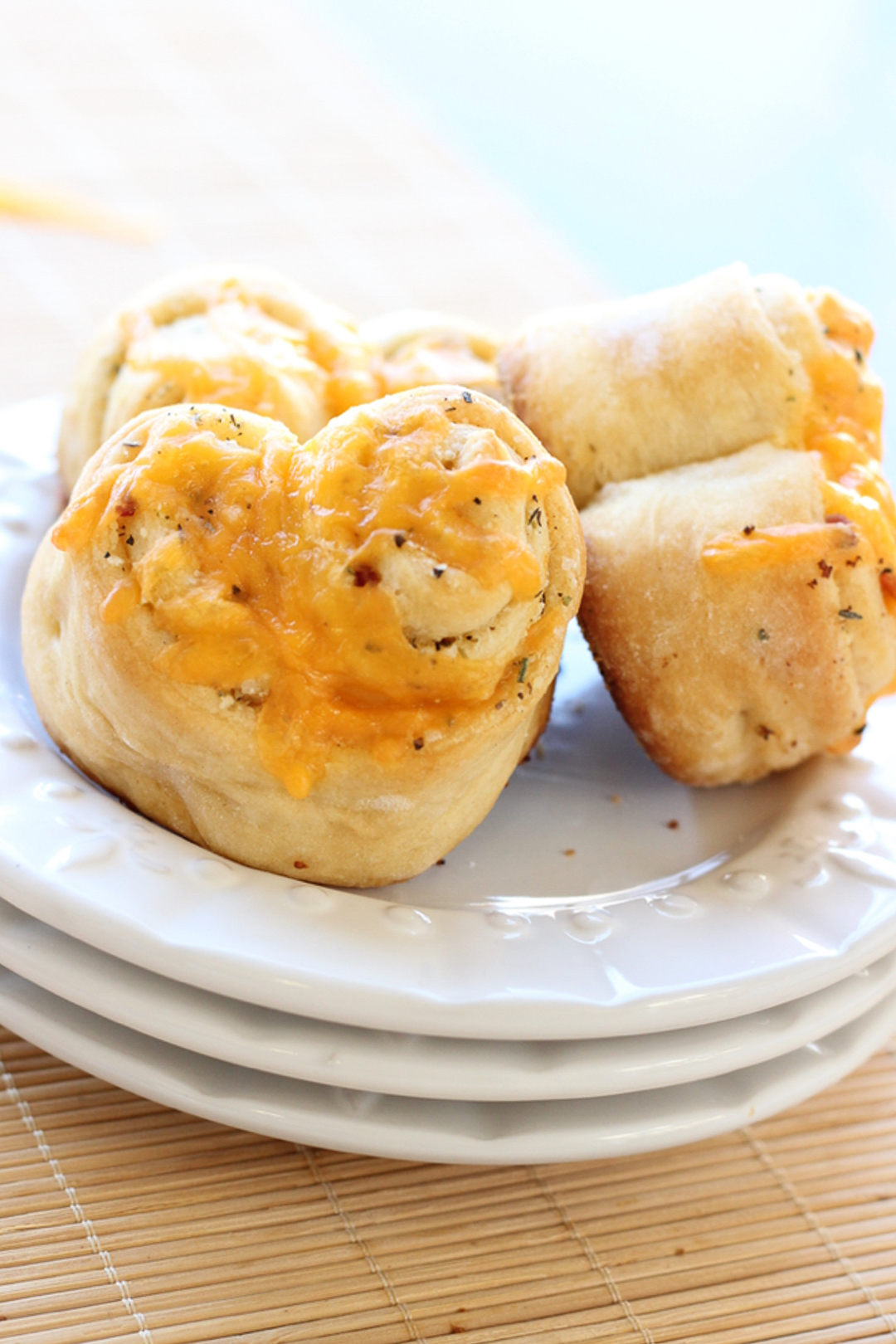 Cheesy garlic rolls on a plate.