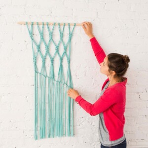 Easy turquoise DIY macrame wall hanging tutorial by A Beautiful Mess.