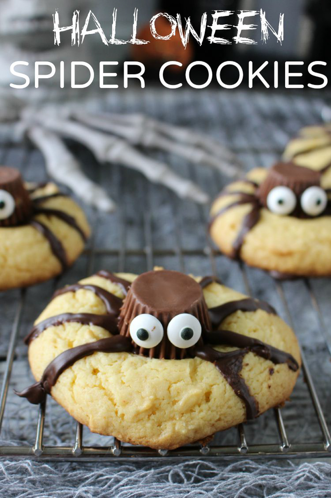 spider peanut butter blossom cookies with a peanut butter cup on top as the spider body.