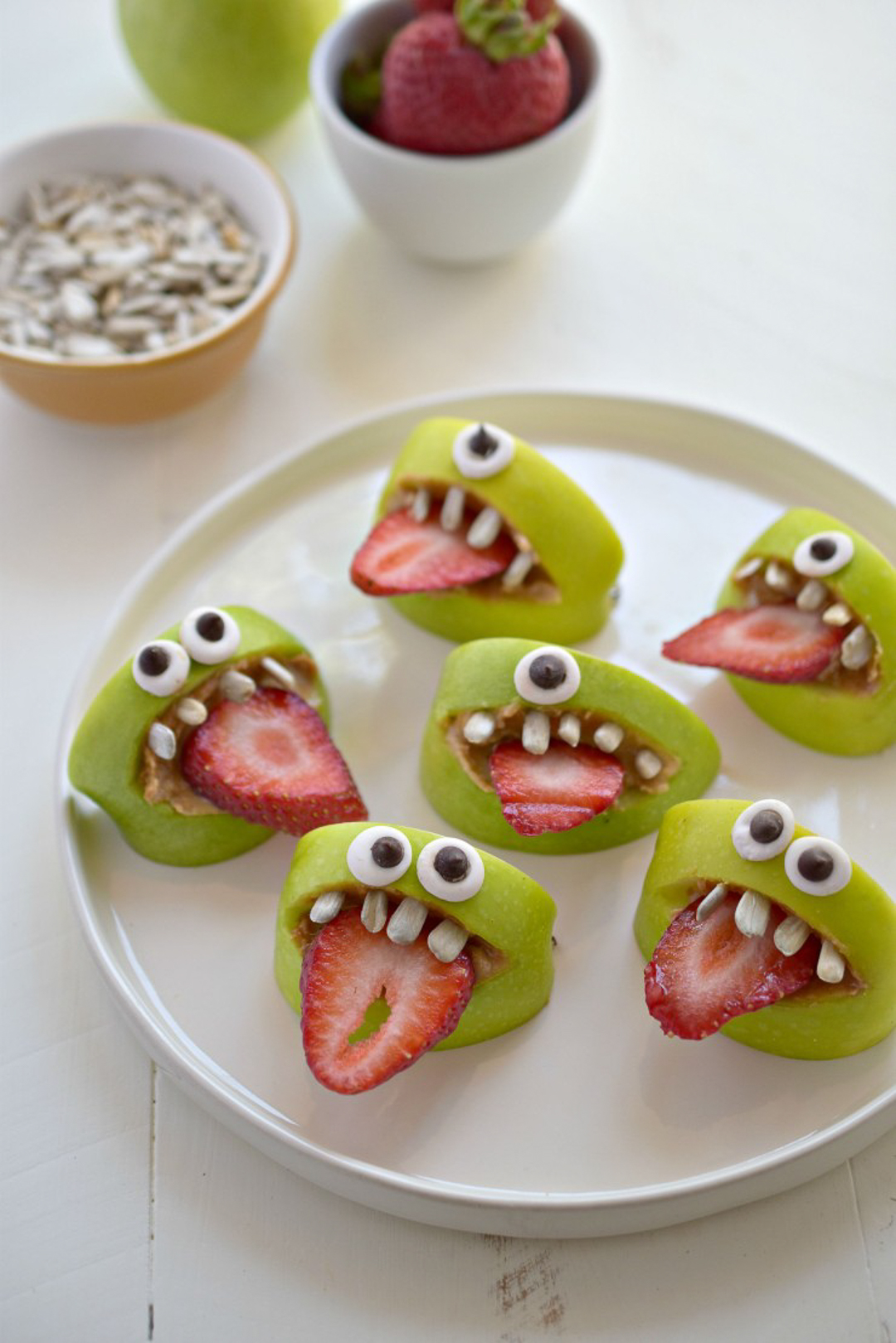 Silly apple and strawberry monster face halloween treats.