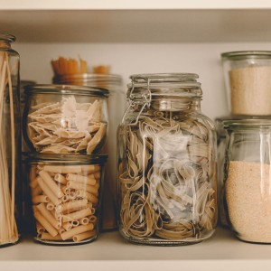 jars with pasta in them.