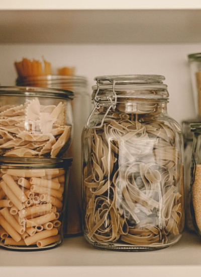 jars with pasta in them.