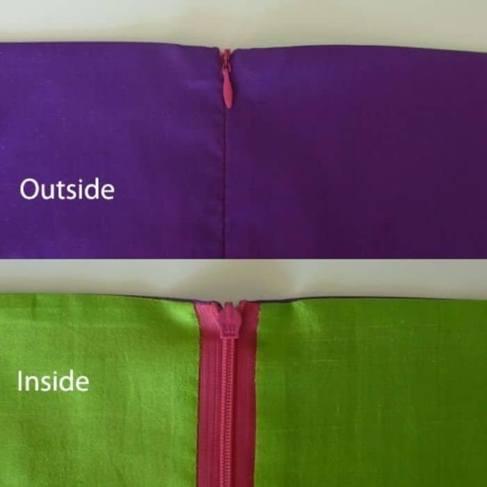 image of inside and outside of lined garment highlighting zipper. Outside zipper doesn't show, inside zipper is pink with green fabric