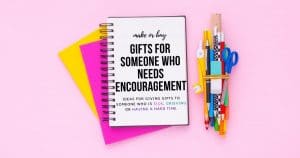 pink background, empty notebook. Text: gifts for someone who needs encouragement