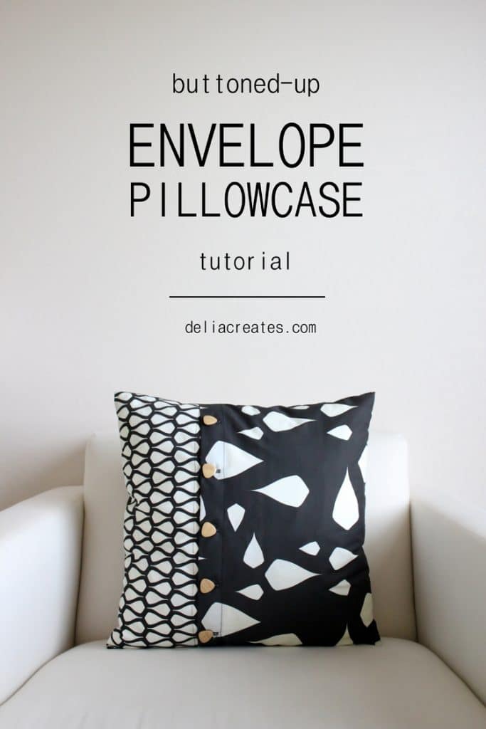 text: buttoned up envelope pillowcase tutorial by deliacreates.com - black and white pillow with buttons up the front sitting on a white chair.