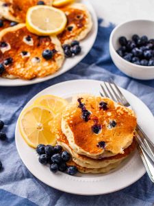lemon blueberry pancakes on plate.