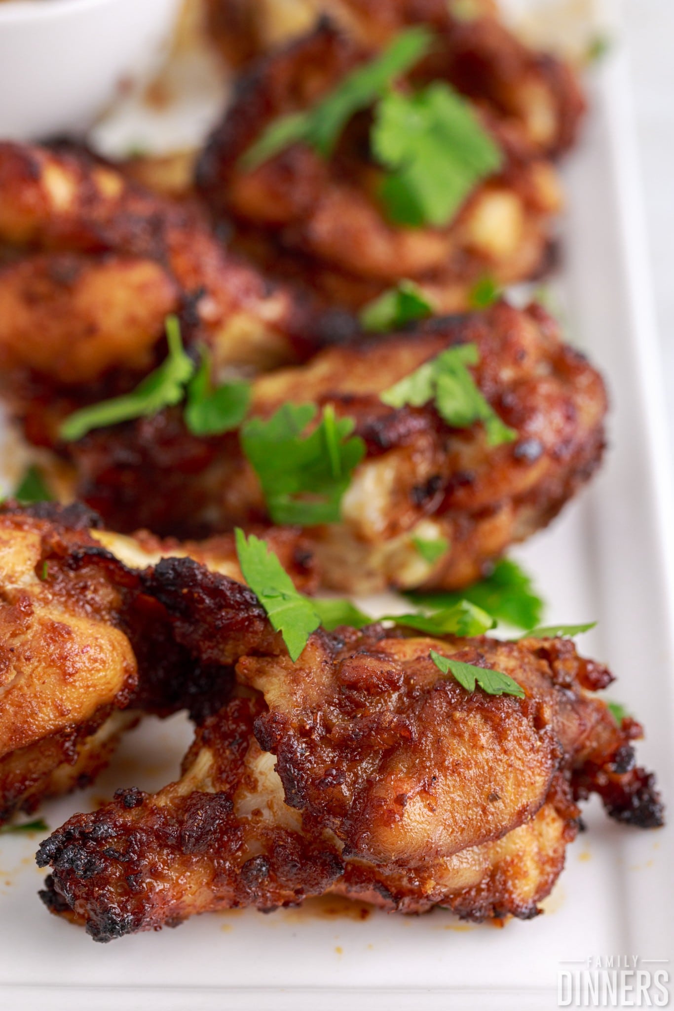 chipotle chicken wings on a plate.