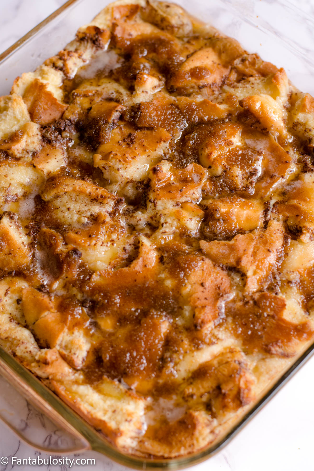 Baking dish full of cooked bread pudding.