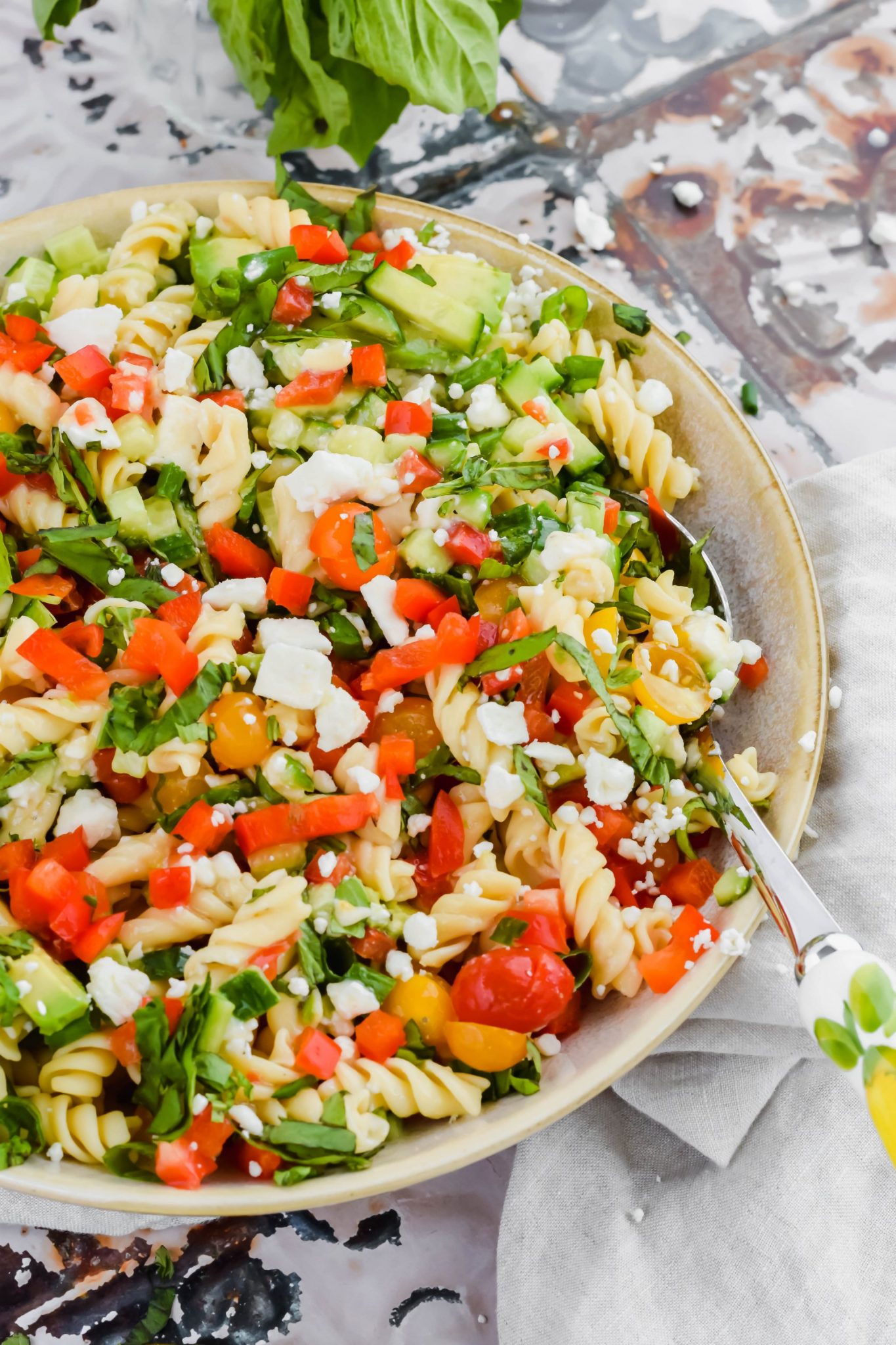 Chickpea pasta salad in a bowl makes a great potluck dinner idea.