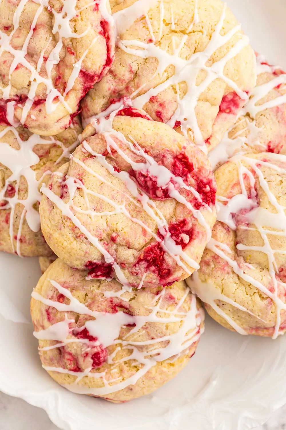 Lemon raspberry cookies on a plate.