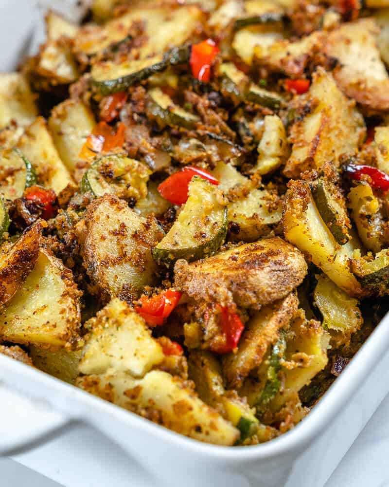 Potato and zucchini casserole in a baking dish.