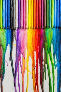 Crayons melting on canvas.