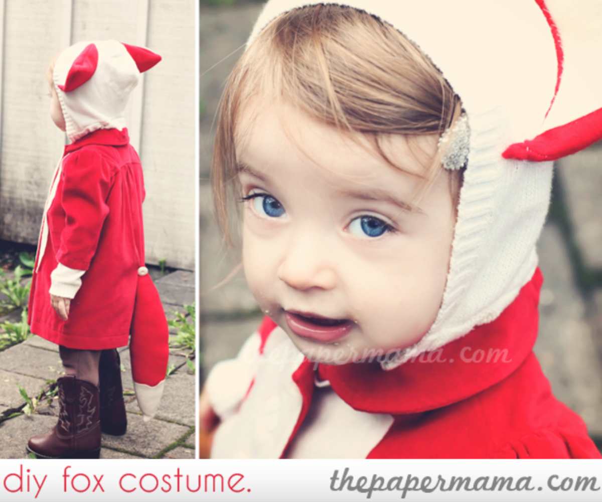 Cute little girl wearing a red coat with white hood and white and red DIY fox ears attached to the hood.
