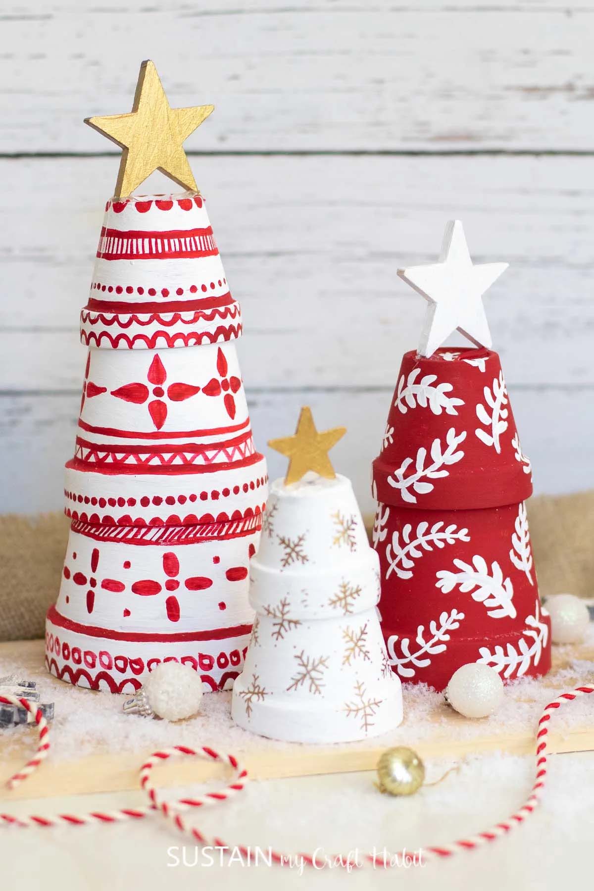 Terra cotta pots painted as christmas trees.