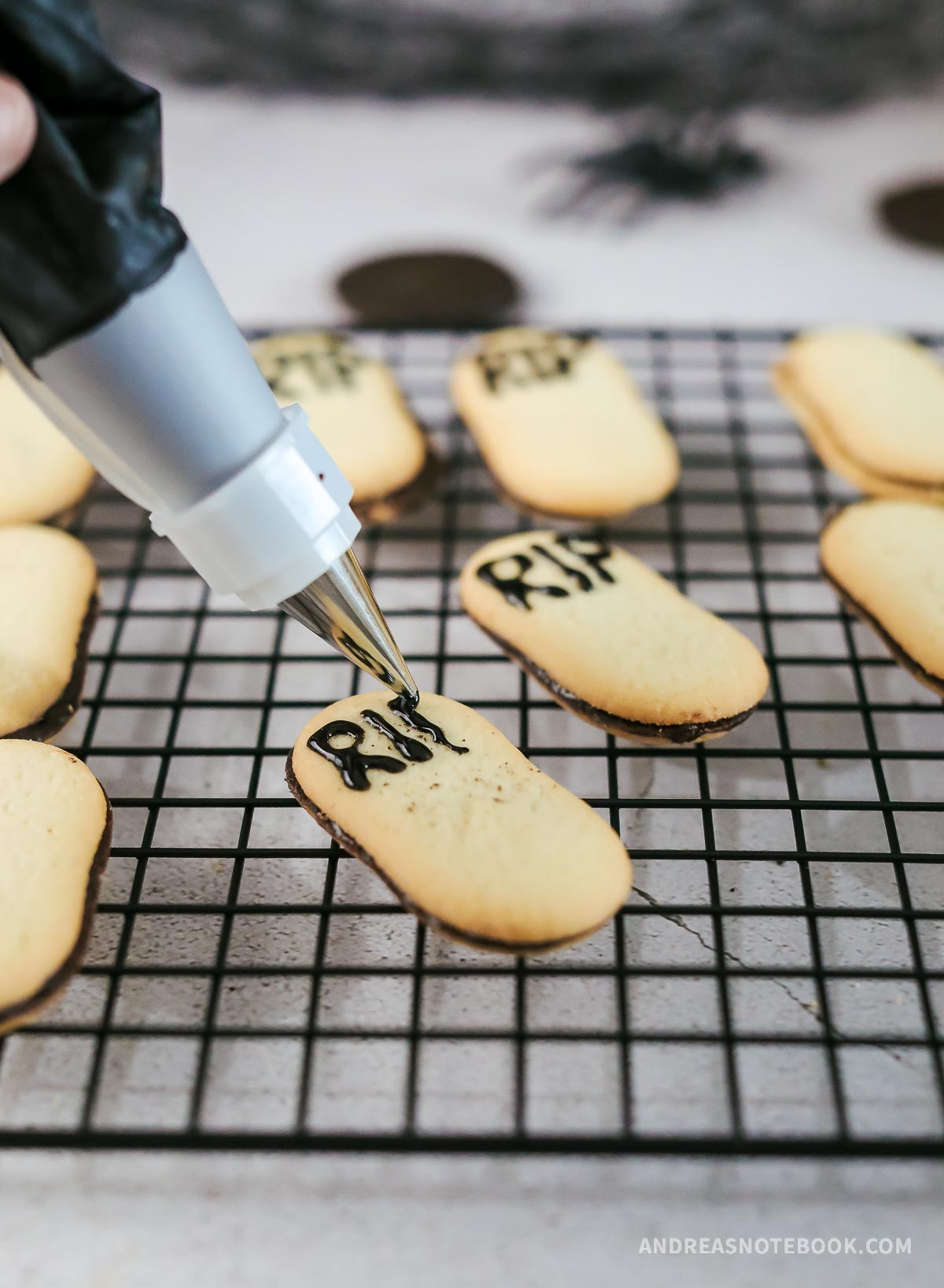Gel icing writing RIP on Milano cookie.