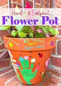 Kid painted handprint flower pot idea.