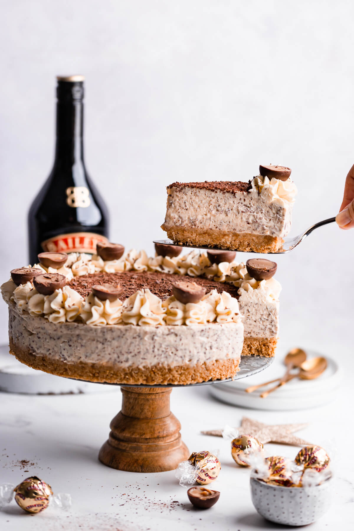 Bailey's Cheesecake on a cake stand.