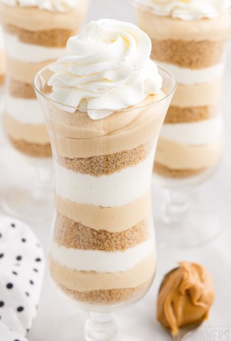 Peanut Butter cheesecake parfaits in a tall glass.