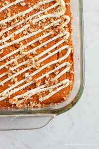 Bumpkin bars with icing drizzle in a baking dish.