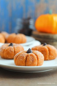 pumpkin cheesecake truffles with a chocolate chip on top.