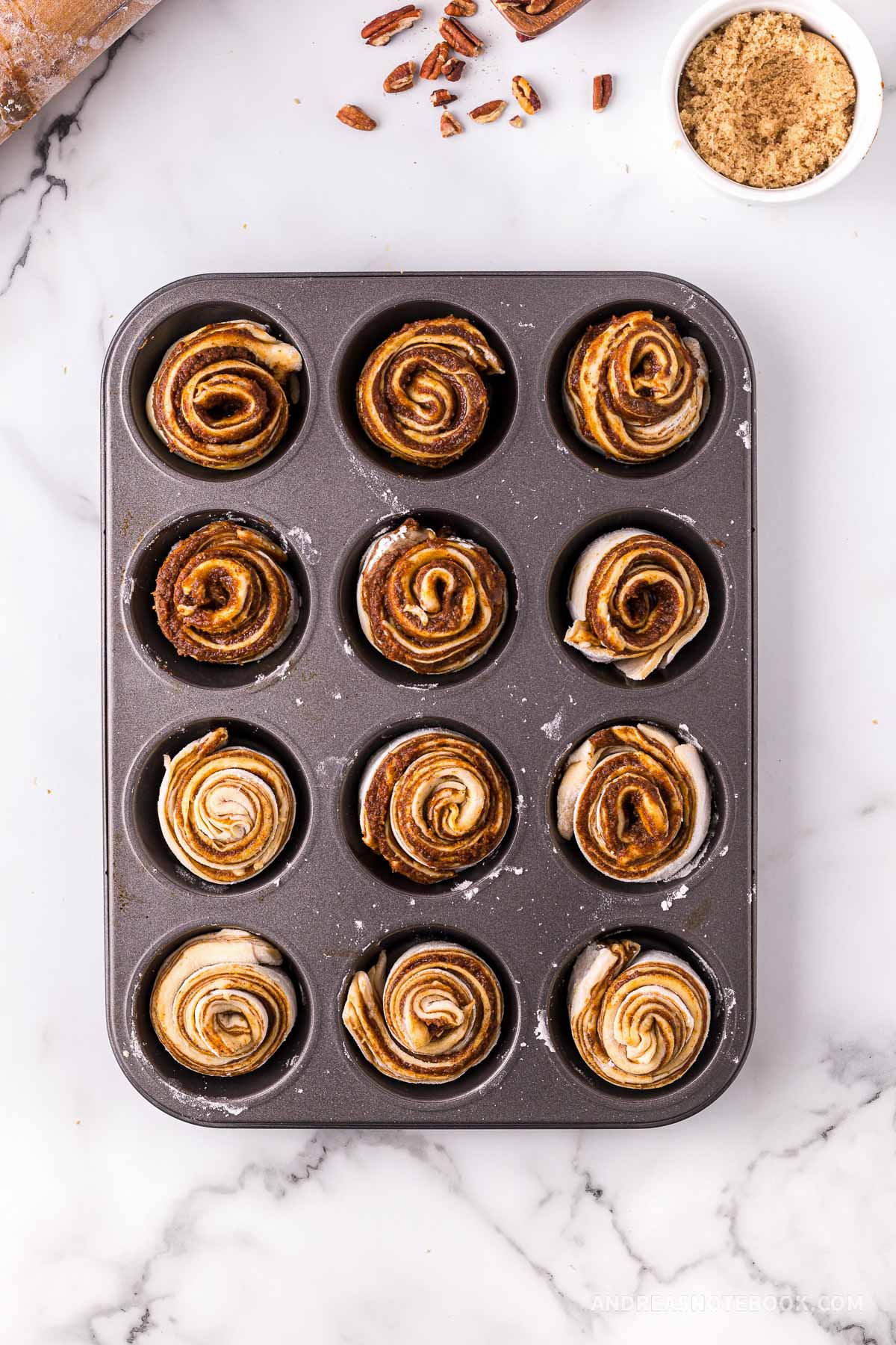 Cinnamon rolls in muffin tin.