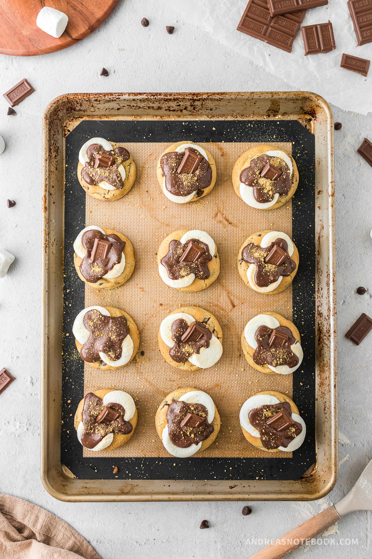 Cooked s'mores cookies on a baking sheet.