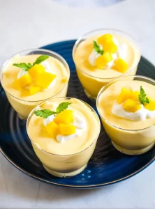 Mango mousse in 4 glasses.