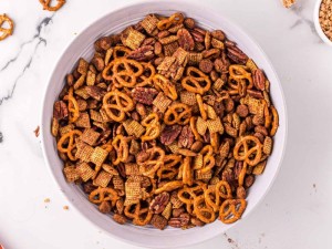 Cooked chex mix in a bowl.