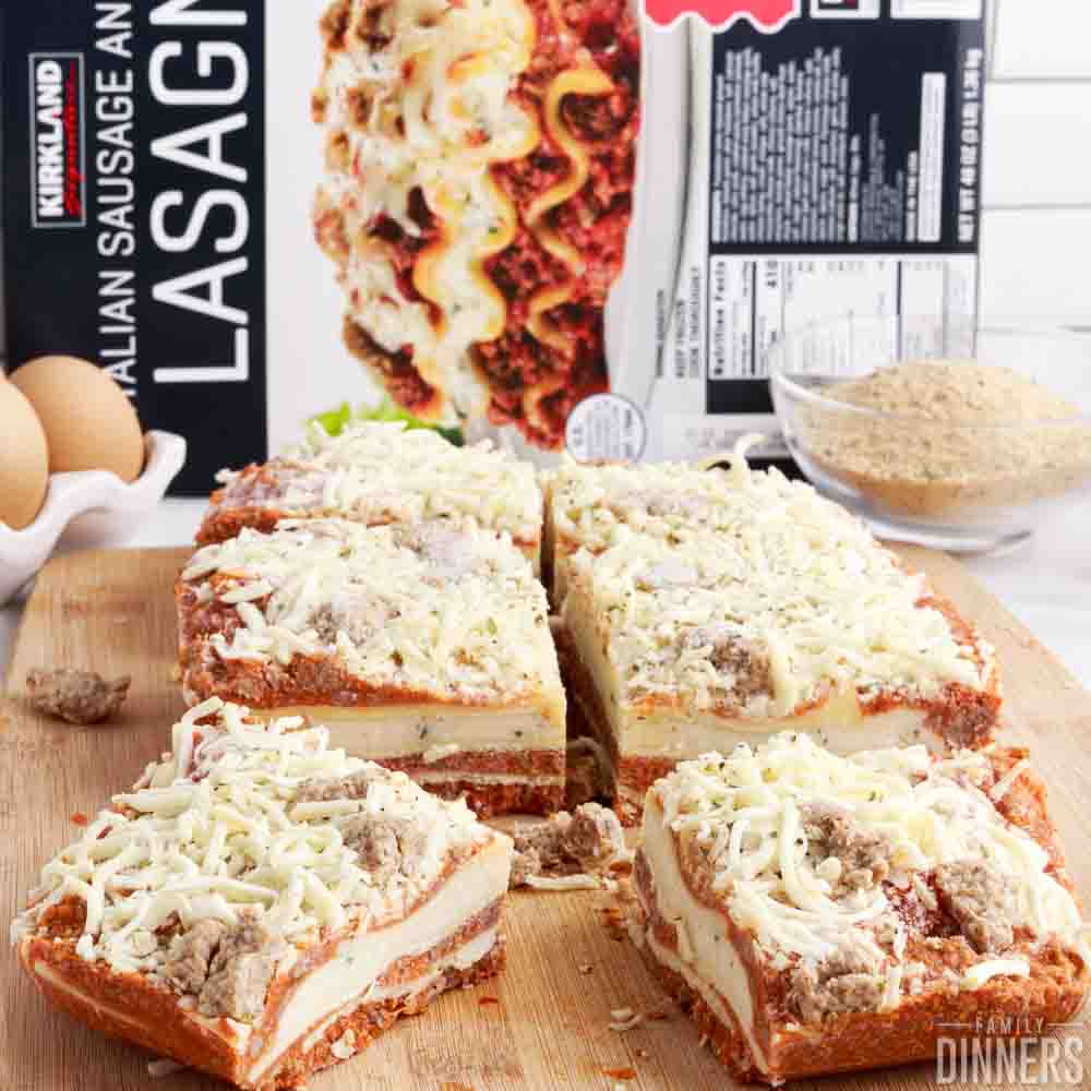 Costco frozen lasagna cut up into serving sized pieces.