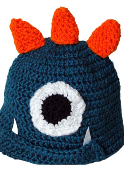 Blue crocheted monster hat with orange spikes and one eye.