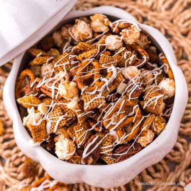 christmas white chocolate chex mix recipe in a pumpkin shaped bowl.
