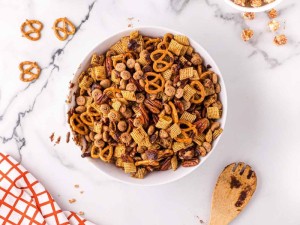 Chex mix ingredients in a bowl.