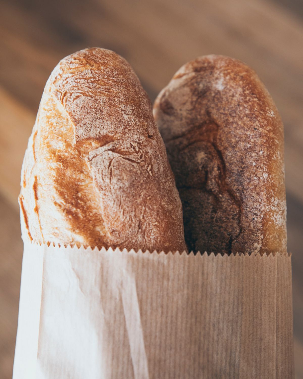 fresh crusty bread in a paper bag.