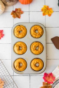 Cooked pumpkin spice donuts in a donut baking pan.